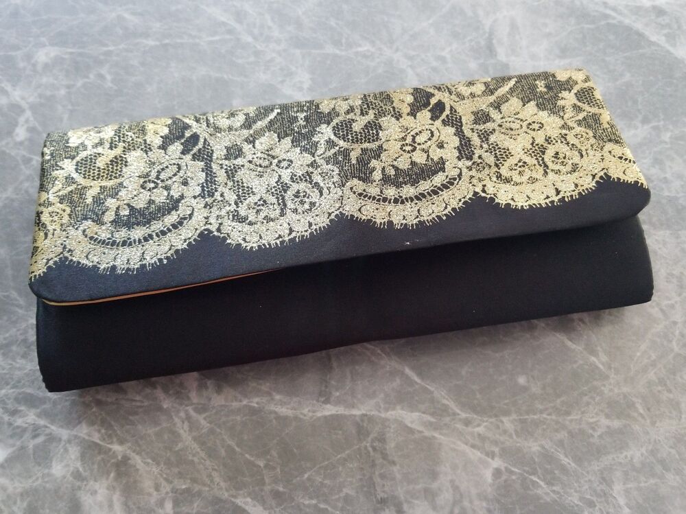 Avon gold glitter and black  clutch new